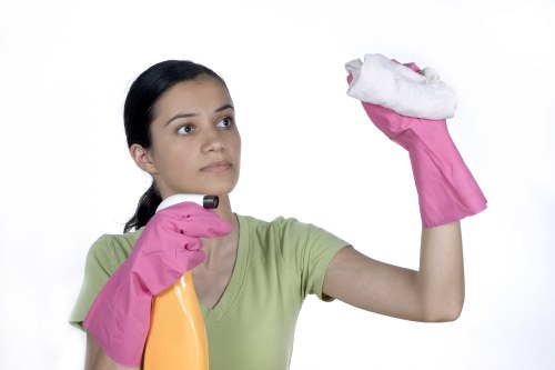 Finished carpet cleaning service with professional equipment in use